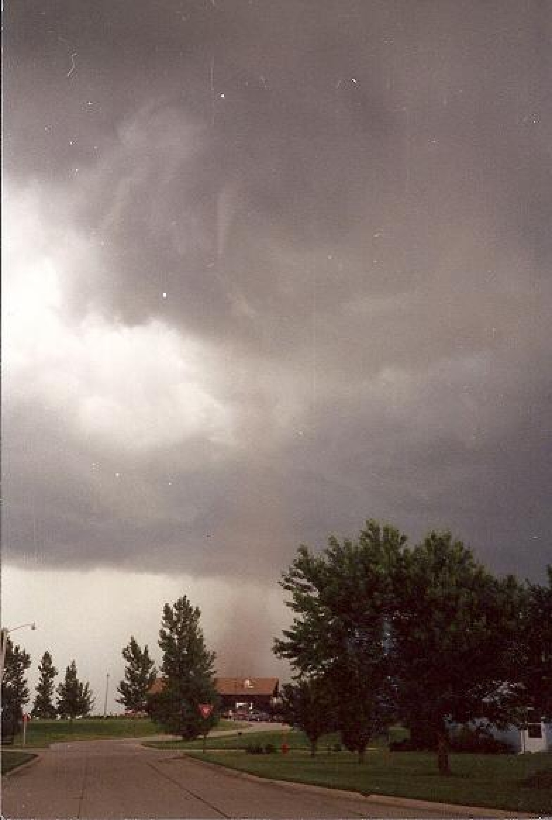 The tornado's cloud contact funnel directly above the club house.